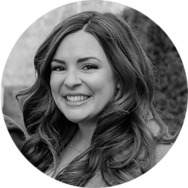 Black and white, circle-cropped headshot of Tricia G, Senior Manager, Marketing Operations